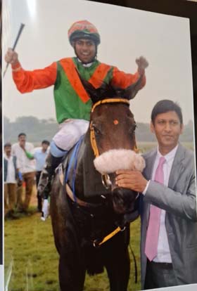 Trainer Prasad Raju who achieved the landmark of saddling 1000 winners seen leading in one of the best horses he trained, Lady In Lace (Suraj Narredu up), after the success in Pune Derby several years ago.